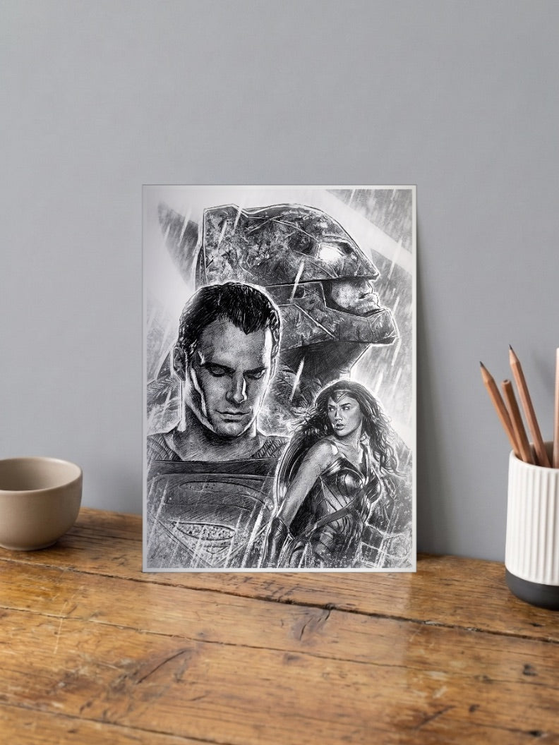 Batman V Superman Sketch DC Poster shown in A4 size on a wooden desk