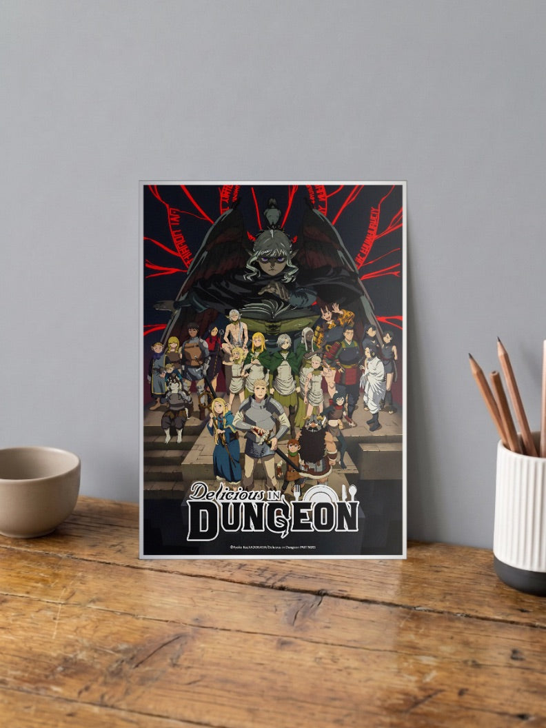 Delicious In Dungeon Key Visual Anime Poster shown in A4 size on a wooden desk