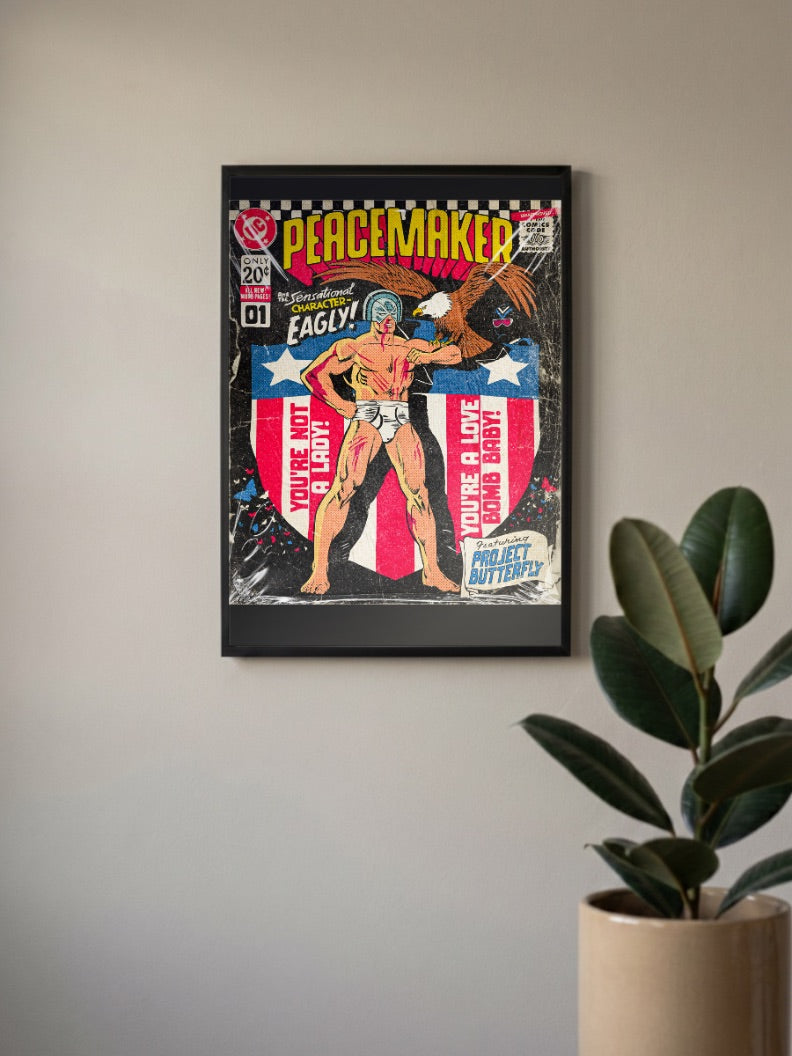 Peacemaker Eagly Cover DC Poster in a black frame, mounted on a wall
