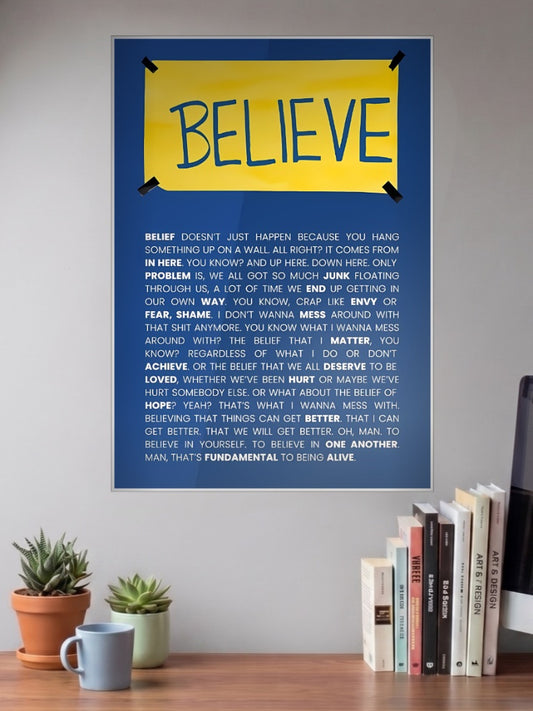 Ted Lasso Yellow Believe Sitcom Poster shown in A3 size on a wall above a study desk