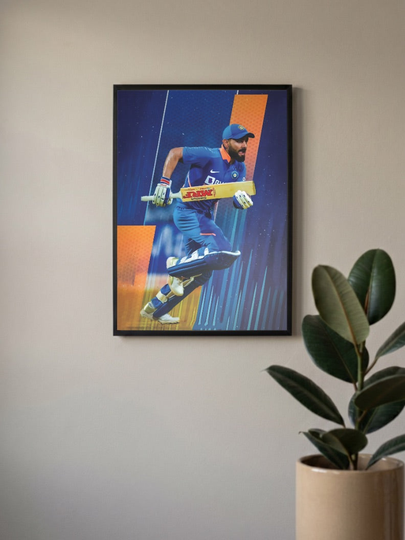 Virat Kohli Running Cricket Poster in a black frame, mounted on a wall