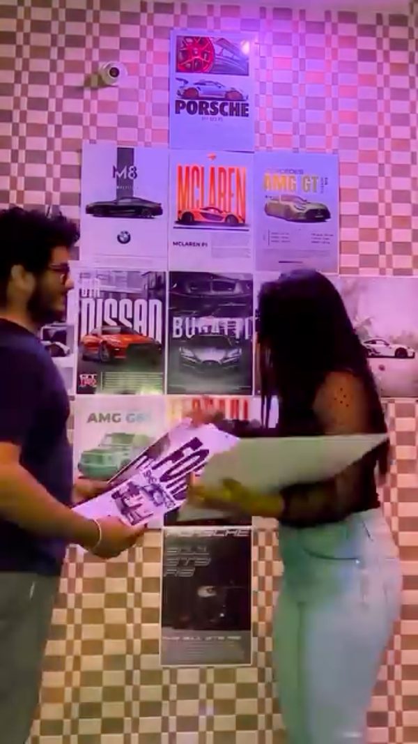 Couple putting Wall Posters